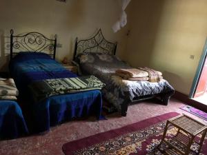 Кровать или кровати в номере GITE LA GROTTE VALLEE