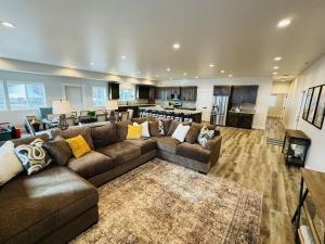 a large living room with a couch and a kitchen at Pickleball Paradise at Star Valley Ranch! in Thayne