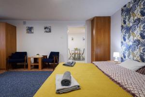 Postel nebo postele na pokoji v ubytování Apartamenty przy Parku