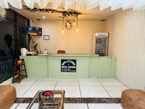 a bar in a restaurant with a counter at Hotel Fontana in Dharamshala