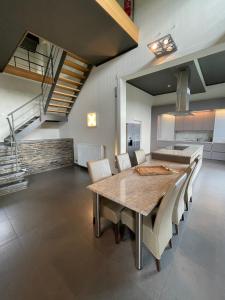 a kitchen and dining room with a table and chairs at Villa Livingstone in La Roche-en-Ardenne