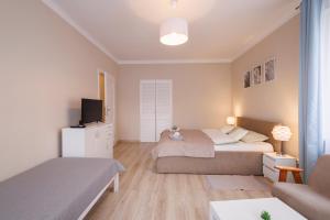 Postel nebo postele na pokoji v ubytování Apartamenty przy Parku