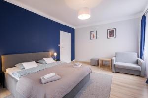 Postel nebo postele na pokoji v ubytování Apartamenty przy Parku