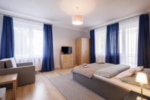 Postel nebo postele na pokoji v ubytování Apartamenty przy Parku