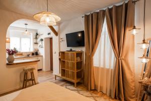 a room with a bed and a window with a curtain at HarmoNee - Central Retreat in Braşov