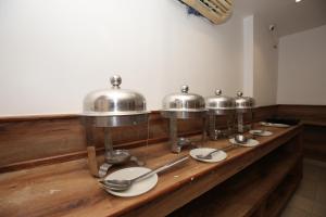 A kitchen or kitchenette at Hotel RV Regency