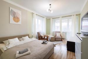 Postel nebo postele na pokoji v ubytování Apartamenty przy Parku