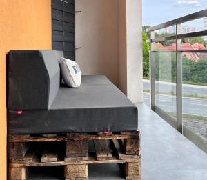 a mattress sitting on a platform on a balcony at Studio Kasprzaka 17 in Olsztyn