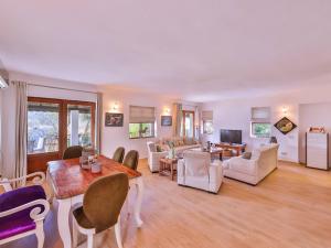 a large living room with a table and chairs at Villa Sarpedon in Kaş