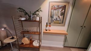 a room with a shelf with bottles of wine at Calming Mountain View Apt with Balcony & Free Parking near Kakopetria in Nicosia +27 photos