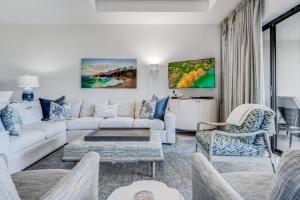 a living room with a couch and a table at MAKENA SURF #C102 condo in Wailea