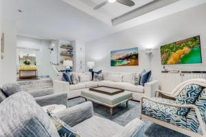 a living room with a couch and chairs at MAKENA SURF #C102 condo in Wailea