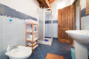 a bathroom with a sink and a toilet and a shower at B&B Alla Borgata in Boves