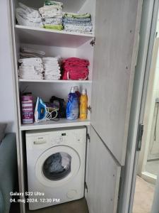 a laundry room with a washing machine in it at Vila Paradise in Bar
