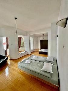 a large bedroom with two beds in it at Vila Wiese Poiana Brasov in Braşov