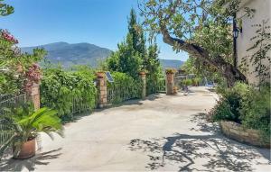 a walkway with a fence and plants on it at Casa Antonia in Castellabate +12 photos