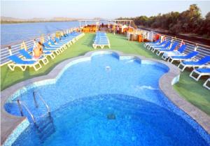 a large swimming pool on the side of a cruise ship at live Nile in style Nile cruise in Luxor and Aswan in Luxor