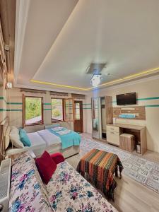 A bed or beds in a room at Konak Grand Apart
