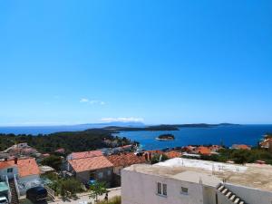 a view of the city and the water at Apartment Lantana Hvar in Hvar