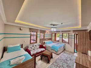 A bed or beds in a room at Konak Grand Apart