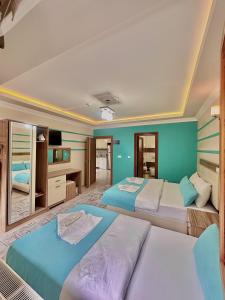 A bed or beds in a room at Konak Grand Apart