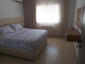Postel nebo postele na pokoji v ubytování Folla Monastir Palm Lake Resort + 24 fotografií