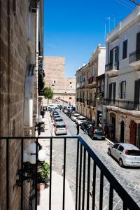 a view of a street with cars parked on the street at Palazzo Boemondo in Bari
