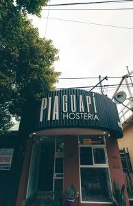 a pizza garage with a sign on top of it at Hosteria Pia Guapi in Colón