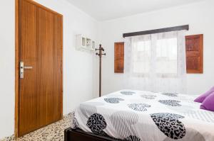 Postel nebo postele na pokoji v ubytování YourHouse Petita, beach house in Majorca North