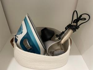 a basket filled with office items on a table at Studio 11 Bis in Vichy