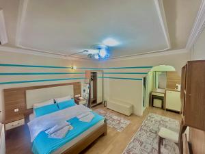A bed or beds in a room at Konak Grand Apart