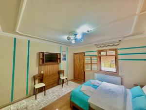 A bed or beds in a room at Konak Grand Apart