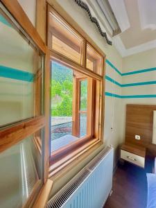 A bed or beds in a room at Konak Grand Apart
