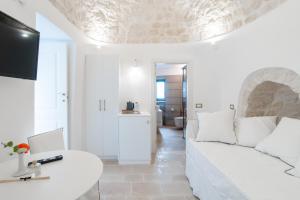 Postel nebo postele na pokoji v ubytování Borgofreddo Luxury Suite