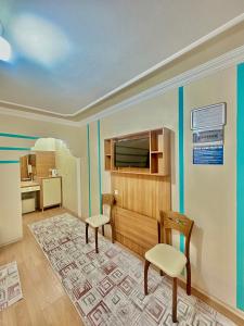 A television and/or entertainment centre at Konak Grand Apart