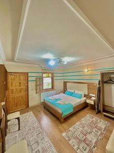 A bed or beds in a room at Konak Grand Apart
