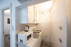 Η κουζίνα ή μικρή κουζίνα στο Holiday Apartments Bellariva +44 φωτογραφίες