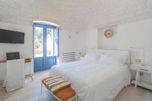Postel nebo postele na pokoji v ubytování Borgofreddo Luxury Suite + 37 fotografií