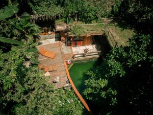 an overhead view of a pool with a wooden deck at Paraty Paradiso in Parati-Mirim