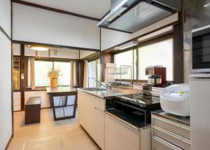 a kitchen with a sink and a counter top at 宝乃小宿 TAKARA no Koyado in Kofu