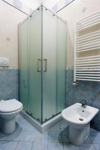 a bathroom with a shower and a toilet and a sink at Palazzo Boemondo in Bari