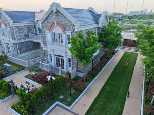 an aerial view of a house with a yard at Stanford Garden in Shanghai