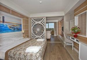 a bedroom with a large bed and a bathroom at Hotel Makadi sharm elshekh in Sharm El Sheikh