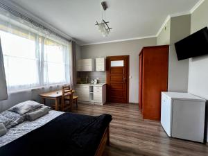 Kuchyňa alebo kuchynka v ubytovaní Domek Długa