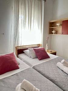 Postel nebo postele na pokoji v ubytování Hermes Casa Hersonissos