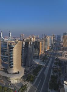 a view of a city with a building and a street at J 22 Residence in Lusail