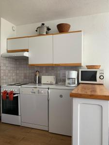 Η κουζίνα ή μικρή κουζίνα στο Appartement proximité immédiate des pistes
