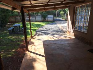 an outside view of a porch of a house at Siesta Cottage in Howick