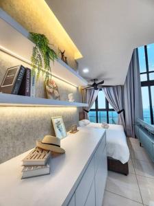 a bedroom with a bed and a white counter with a desk at 2-6Pax Luxury Almas Duplex Suite Legoland near JB & Tuas in Nusajaya
