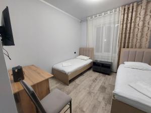 Postel nebo postele na pokoji v ubytování Bagysh Hotel